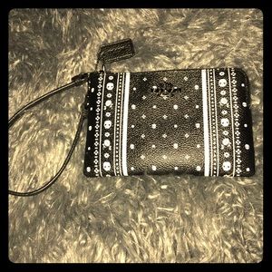 Authentic Coach Wristlet skull/flower pattern